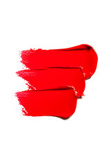 Texture of classic red lipstick on a white background close-up.