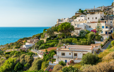 Obraz premium Summer afternoon view in Peschici, beautiful village in the Gargano region of Puglia (Apulia), Italy.