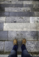 Feet of man on stairs