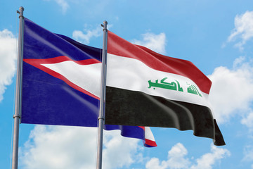 Iraq and American Samoa flags waving in the wind against white cloudy blue sky together. Diplomacy concept, international relations.
