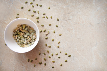 sunflower seeds in a glass Cup on a wooden background