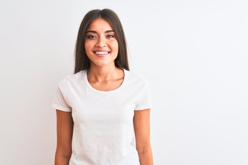 Young beautiful woman wearing casual t-shirt standing over isolated white background with a happy and cool smile on face. Lucky person.