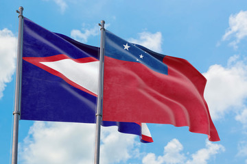 Samoa and American Samoa flags waving in the wind against white cloudy blue sky together. Diplomacy concept, international relations.