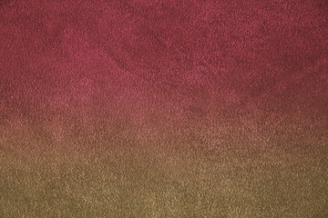 The texture of natural suede. Purple background of leather material.