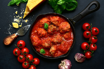 Spicy meatballs in tomato sauce. Top view with copy space.
