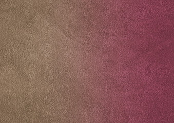 The texture of natural suede. Purple background of leather material.