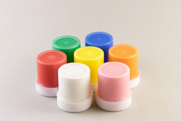 Colorful vibrant cans of gouache isolated on white