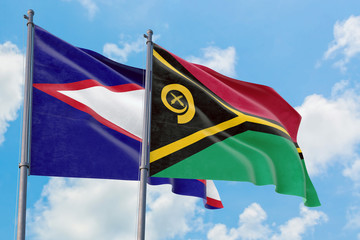 Vanuatu and American Samoa flags waving in the wind against white cloudy blue sky together. Diplomacy concept, international relations.