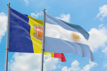 Argentina and Andorra flags waving in the wind against white cloudy blue sky together. Diplomacy concept, international relations.