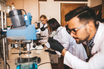 Fototapeta premium Middle age scientists and researchers work in chemical laboratory.