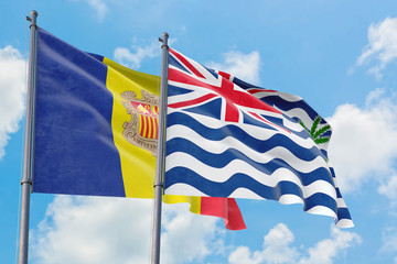 British Indian Ocean Territory and Andorra flags waving in the wind against white cloudy blue sky together. Diplomacy concept, international relations.