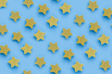 Yellow stars on blu background, place for text. pink cookies. Copy space. Mock up