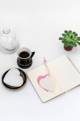 Valentine's Day composition. Female desktop with cup of coffee
