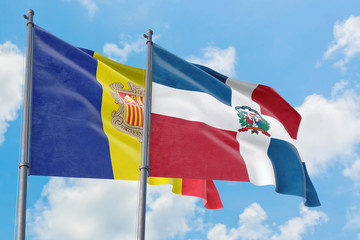 Dominican Republic and Andorra flags waving in the wind against white cloudy blue sky together. Diplomacy concept, international relations.