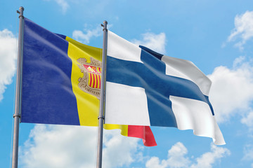 Finland and Andorra flags waving in the wind against white cloudy blue sky together. Diplomacy concept, international relations.