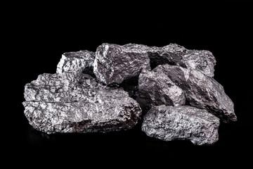 large silver nugget on black background. Raw silver stone, silver nugget native to Liberia, isolated on black background. Mineral extraction.