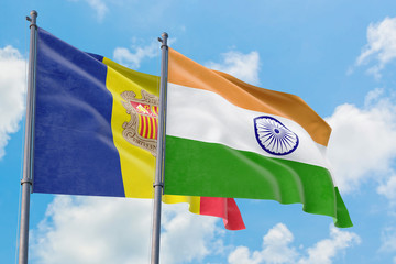 India and Andorra flags waving in the wind against white cloudy blue sky together. Diplomacy concept, international relations.
