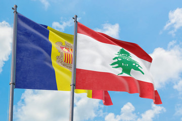 Lebanon and Andorra flags waving in the wind against white cloudy blue sky together. Diplomacy concept, international relations.