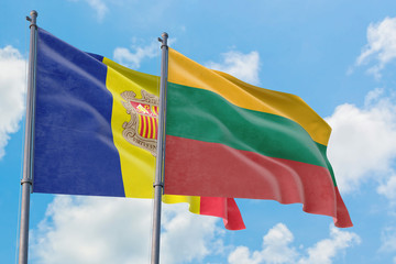 Lithuania and Andorra flags waving in the wind against white cloudy blue sky together. Diplomacy concept, international relations.