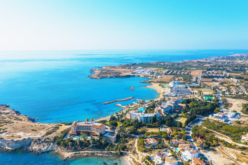 Aerial panoramic view of Cyprus landscape with hotels, bays with beaches and clear mediterranean sea water. Travel to Cyprus concept with copy space.