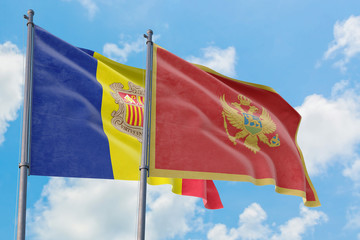 Montenegro and Andorra flags waving in the wind against white cloudy blue sky together. Diplomacy concept, international relations.