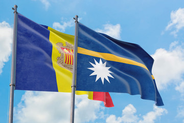 Nauru and Andorra flags waving in the wind against white cloudy blue sky together. Diplomacy concept, international relations.
