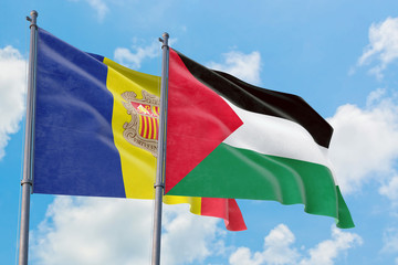 Palestine and Andorra flags waving in the wind against white cloudy blue sky together. Diplomacy concept, international relations.