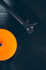 Close up of turntable  tonearm playing vinyl record