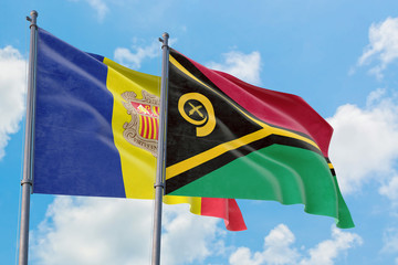 Vanuatu and Andorra flags waving in the wind against white cloudy blue sky together. Diplomacy concept, international relations.