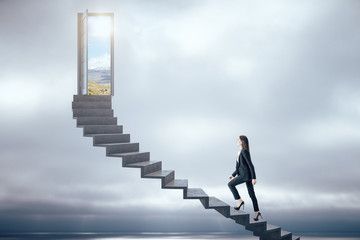 Fototapeta Businesswoman walking on ladder to success obraz