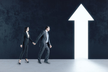Fototapeta premium Businessman and businesswoman walking to abstract white arrow