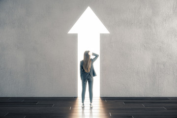 Businessman looking on abstract white arrow
