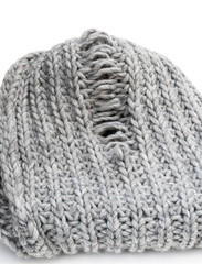 Light grey knitting texture with manufacturing defect isolated on white