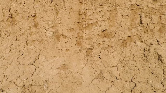background texture wall of earth and clay on the beach