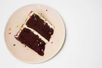 piece of chocolate cake on a plate isolated on white