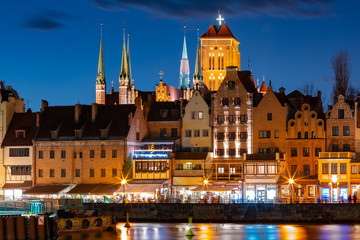 Old Town of Gdansk, Dlugie Pobrzeze, Bazylika Mariacka or St Mary Church, City hall and Motlawa River at night, Poland © Kavalenkava