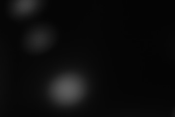 Black and white bokeh of Christmas lights and illuminations.