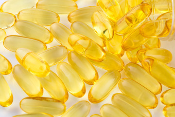fish oil capsules on white background