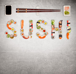 Fototapety  Tradycyjne japońskie sushi kawałki co napis. Obraz o bardzo wysokiej rozdzielczości.