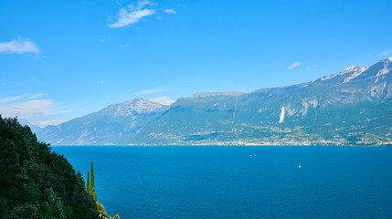 Fototapeta premium Panorama of the gorgeous Lake Garda surrounded by mountains in Riva del Garda, Italy.