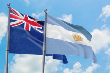 Argentina and Anguilla flags waving in the wind against white cloudy blue sky together. Diplomacy concept, international relations.