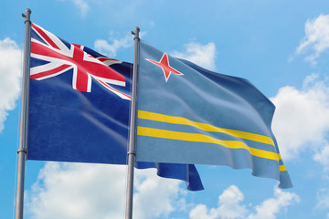 Aruba and Anguilla flags waving in the wind against white cloudy blue sky together. Diplomacy concept, international relations.