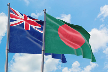 Bangladesh and Anguilla flags waving in the wind against white cloudy blue sky together. Diplomacy concept, international relations.