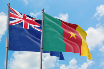 Cameroon and Anguilla flags waving in the wind against white cloudy blue sky together. Diplomacy concept, international relations.