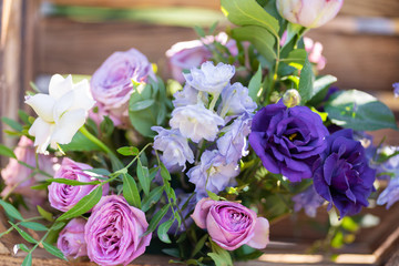 Bouquets of fresh flowers decoration of the festive table. Celebrating an open air party. Decor Details
