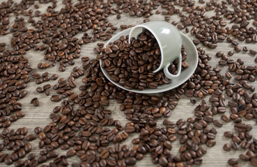 Roasted coffee beans in a coffee mug