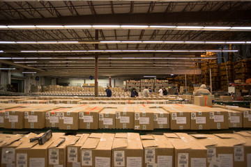 Cardboard boxes arranged in distribution warehouse