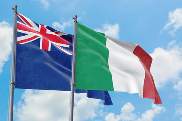 Italy and Anguilla flags waving in the wind against white cloudy blue sky together. Diplomacy concept, international relations.