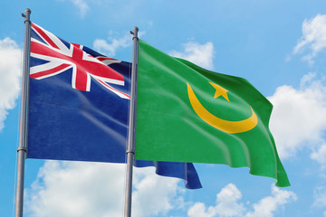 Mauritania and Anguilla flags waving in the wind against white cloudy blue sky together. Diplomacy concept, international relations.