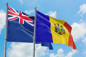 Moldova and Anguilla flags waving in the wind against white cloudy blue sky together. Diplomacy concept, international relations.